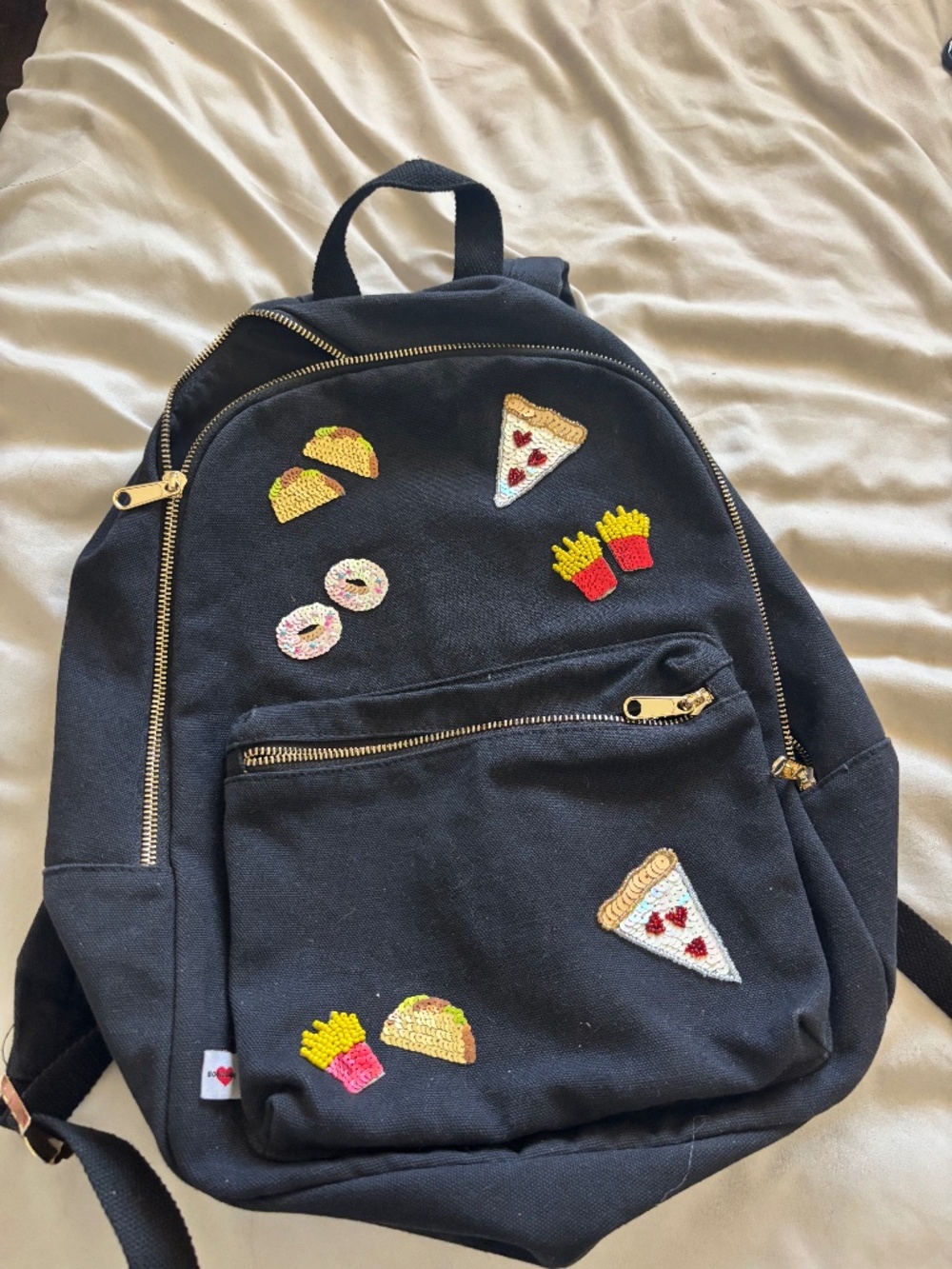 Backpack with sequins patches